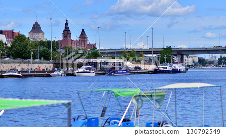Szczecin, Poland. 16 July 2025. Landscape view and ships and boats on the Odra River Szczecin, Poland. 16 July 2025. Landscape view and ships and boats on the Odra River 130792549