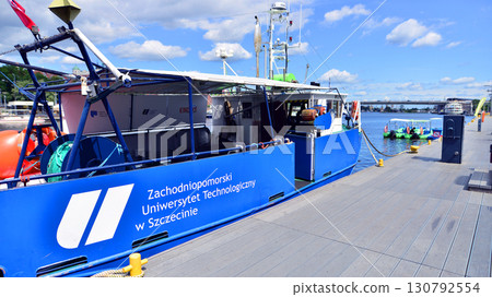 Szczecin, Poland. 16 July 2025. Landscape view and ships and boats on the Odra River Szczecin, Poland. 16 July 2025. Landscape view and ships and boats on the Odra River 130792554