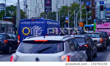 Szczecin, Poland. 16 July 2025. Car traffic at rush hour in downtown area of the city. City center with cars and buildings in the background. Szczecin, Poland. 16 July 2025. Car traffic at rush hour in downtown area of the city. City center with cars and buildings in the background. 130793238