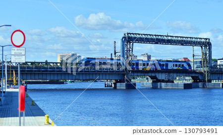 Szczecin, Poland. 16 July 2025. Railway bridge over the Odra River 130793491