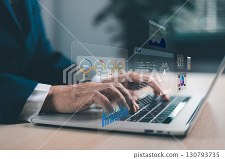 Businessman typing on laptop with AI agents holographic interface. Artificial intelligence for data analytics, automation, digital transformation and innovative business solutions. AI agents 130793735