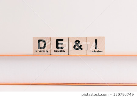 Business concept of diversity, equality, inclusion is symbol DEI written on wooden block, representing core values based on respect, fairness, equal opportunity. diversity, equality, inclusion Business concept of diversity, equality, inclusion is symbol DEI written on wooden block, representing core values based on respect, fairness, equal opportunity. diversity, equality, inclusion 130793749