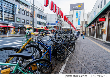 Bicycle parking lot in the shopping district in front of the station Bicycle parking lot in the shopping district in front of the station 130793759
