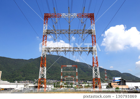 Transmission lines that carry large amounts of electricity from power plants to substations and consumption areas Transmission lines that carry large amounts of electricity from power plants to substations and consumption areas 130793869