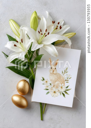 Easter greeting card with bunny and white lilies lying on gray background 130793935