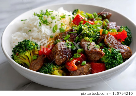 Beef and broccoli stir fry with rice and chives Beef and broccoli stir fry with rice and chives 130794210
