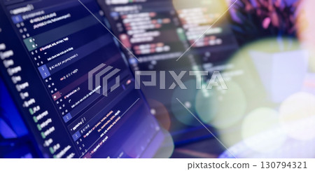 Close-up of coding screens in modern workspace Close-up of coding screens in modern workspace 130794321