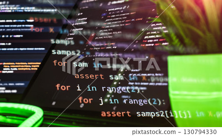 code using loops and assertions on a multi-screen setup, showing modern development and software engineering in action. code using loops and assertions on a multi-screen setup, showing modern development and software engineering in action. 130794330