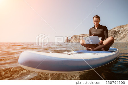 Woman Laptop Paddleboarding Ocean Beach Digital Nomad Work Lifestyle 130794600