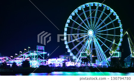 Szczecin, Poland. 16 July 2025. Ferris wheel on the river at night 130794780