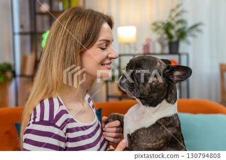 Middle-aged woman with dog face closeup portrait gentle smile sweet bond warm heart happy mood shot 130794808