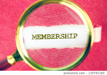 MEMBERSHIP word was found using a magnifying glass under a piece of paper. Business Web Promotion Marketing Concept. 130795160