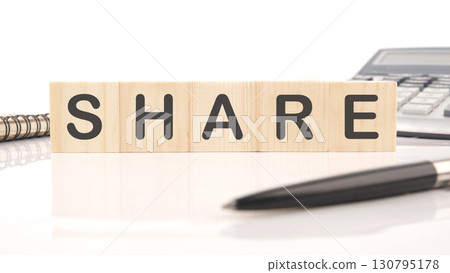 The concept word SHARE is collected of wooden cubes on a white background. Technology, website concept 130795178