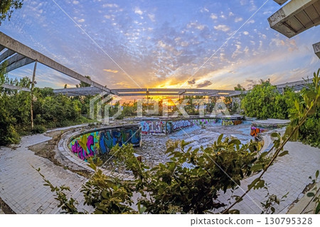 Sunset over ruined outdoor pools at Haludovo Palace Hotel Krk Croatia 130795328