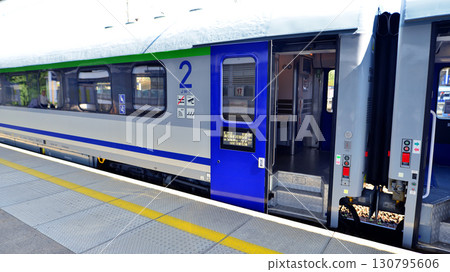 Warsaw, Poland. 15 July 2025. The intercity train stands at the railway station Warsaw, Poland. 15 July 2025. The intercity train stands at the railway station 130795606