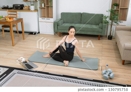 Healthy woman workout at home, exercise, fit, doing yoga, home fitness concept. healthy lifestyle. 130795758