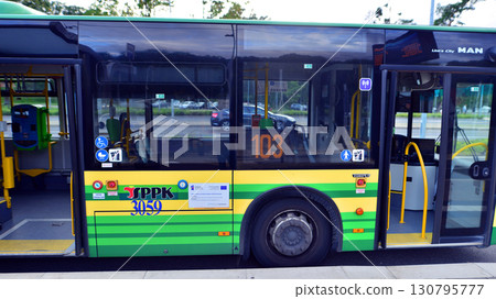 Szczecin, Poland. 16 July 2025. Modern bus stopped on a bus stop. Szczecin, Poland. 16 July 2025. Modern bus stopped on a bus stop. 130795777