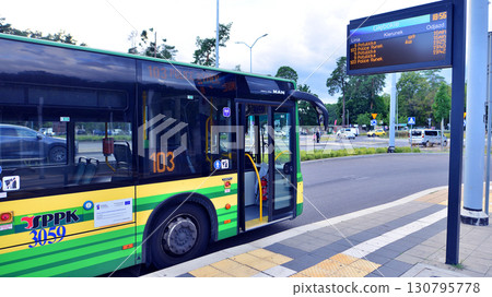 Szczecin, Poland. 16 July 2025. Modern bus stopped on a bus stop. Szczecin, Poland. 16 July 2025. Modern bus stopped on a bus stop. 130795778