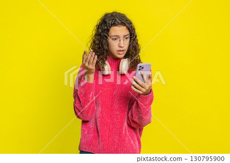 Upset sad girl use smartphone play game loses loss fail unlucky news bad lottery results crisis 130795900