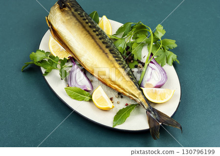 Hot-smoked headless mackerel. 130796199