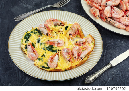 Appetizing omelette with seafood and greens. Appetizing omelette with seafood and greens. 130796202