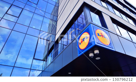 Szczecin, Poland. 16 July 2025. Urban landscape. Neon sign with the inscription: Lidl. 130796212