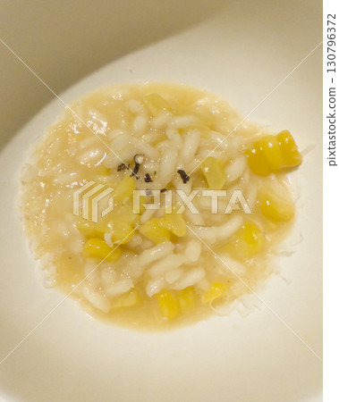 Corn risotto on a white plate Corn risotto on a white plate 130796372