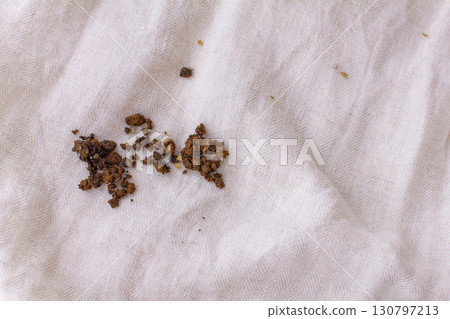 Photo of soil stains on linen clothing Photo of soil stains on linen clothing 130797213