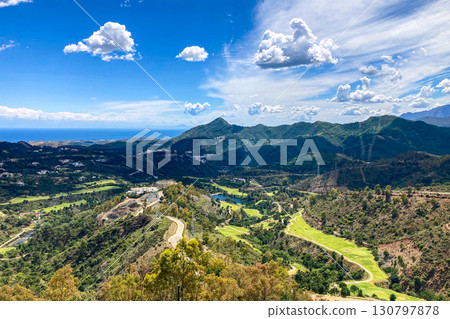 Clouds on blue sky over golf fields, Marbella, Spain 130797878