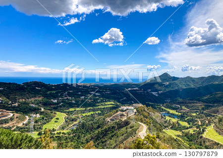 Clouds on blue sky over golf fields, Marbella, Spain 130797879