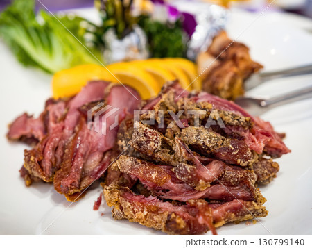 Sliced German Pork Knuckle in plate 130799140