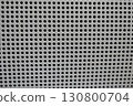 Perforated gray metal sheet with repeating hole pattern. grid texture creates clean industrial feel for modern abstract background 130800704