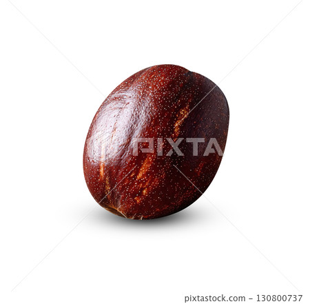 A single nutmeg sits on burlap, showcasing its rich, warm tones and textured surface. Illustrates culinary themes, healthy eating, or ingredient photography. Aromatic spice concept. A single nutmeg sits on burlap, showcasing its rich, warm tones and textured surface. Illustrates culinary themes, healthy eating, or ingredient photography. Aromatic spice concept. 130800737