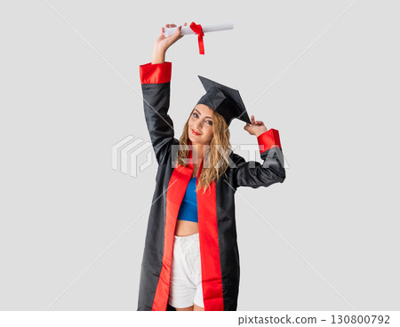 Happy young woman celebrating graduation with diploma Happy young woman celebrating graduation with diploma 130800792