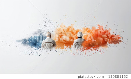 Two figures sitting back to back in front of blue and orange abstract paint explosions. 130801162