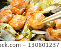 Chinese-style stir-fry of shrimp, shiitake mushrooms and Chinese cabbage, cooking scene. 130801237
