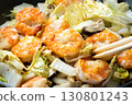 Chinese-style stir-fry of shrimp, shiitake mushrooms and Chinese cabbage, cooking scene. 130801243