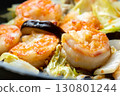 Chinese-style stir-fry of shrimp, shiitake mushrooms and Chinese cabbage, cooking scene. 130801244