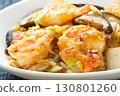 A close-up of Chinese-style stir-fried shrimp, shiitake mushrooms and Chinese cabbage. 130801260
