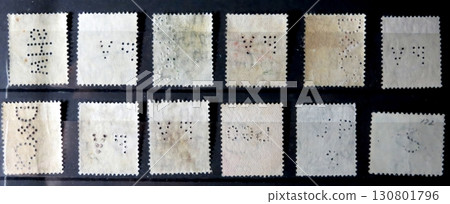 Unique Collection of Perforated Postage Stamps Showcasing Historical Philately on Display 130801796