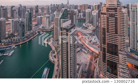 Dubai Marina skyscrapers and jumeirah lake towers view from the top aerial night to day timelapse in the United Arab Emirates. 130802716