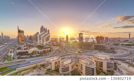 Sunset over Dubai Media City with Modern buildings aerial timelapse, United Arab Emirates Sunset over Dubai Media City with Modern buildings aerial timelapse, United Arab Emirates 130802719