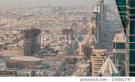 Skyscrapers on Sheikh Zayed Road and DIFC aerial timelapse in Dubai, UAE. Skyscrapers on Sheikh Zayed Road and DIFC aerial timelapse in Dubai, UAE. 130802747