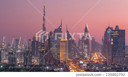 Dubai skyline after sunset with beautiful city center lights and Sheikh Zayed road traffic timelapse, Dubai, United Arab Emirates 130802792