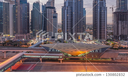Aerial top view to Sheikh Zayed road near Dubai Marina and JLT night to day timelapse, Dubai. 130802832