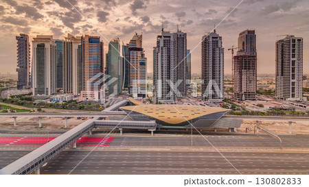 Aerial top view to Sheikh Zayed road during sunrise near Dubai Marina and JLT timelapse, Dubai. 130802833