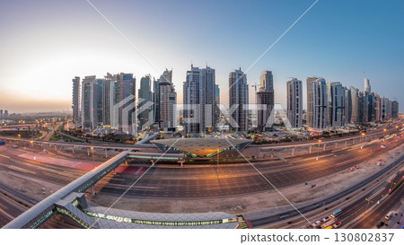 Aerial top view to Sheikh Zayed road near Dubai Marina and JLT night to day timelapse, Dubai. 130802837