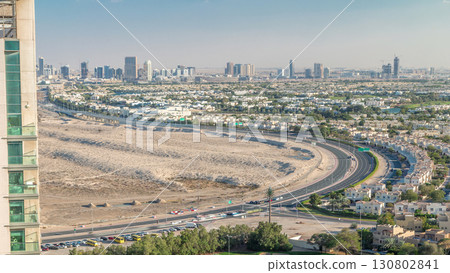 Aerial view to villas and houses with Golf course with green lawn and lakes timelapse 130802841