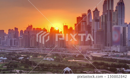 Dubai Marina skyscrapers and golf course sunset timelapse, Dubai, United Arab Emirates 130802842