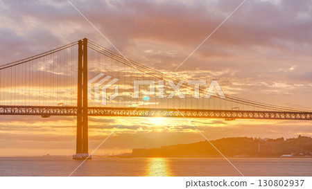 Lisbon city sunrise with April 25 bridge timelapse 130802937